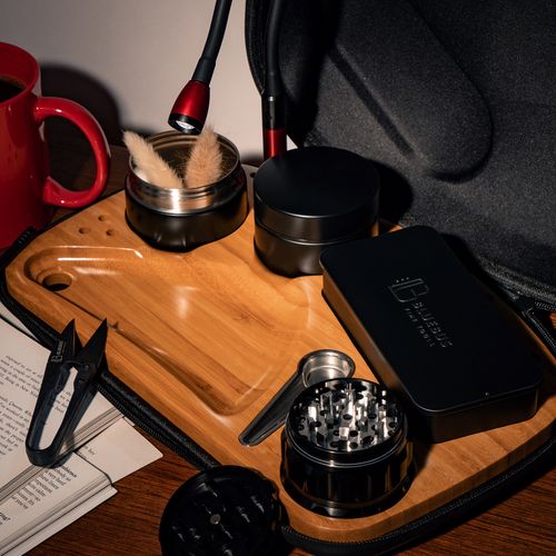 Close-up of premium smoking accessories arranged on a wooden surface